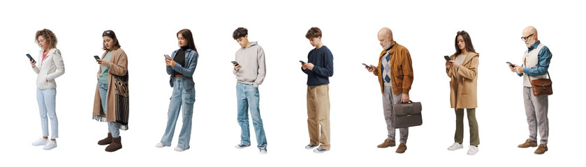 Group of ordinary people of mixed ages standing checking their smartphones