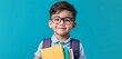 © medienvirus - Happy Young Student: A cheerful young student with glasses and a backpack holds books, radiating an excited anticipation for education.
