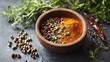 © arhendrix - A bowl of spices with fresh herbs on the side,