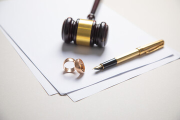 Wall Mural - Judge gavel, documents and wedding rings. Divorce