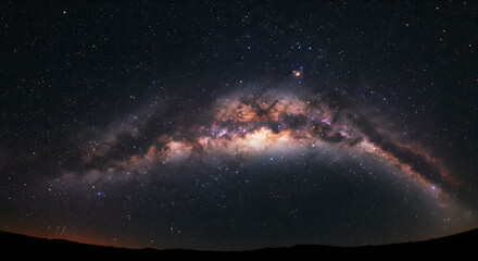 Panoramic view of Milky Way galaxy arc over dark horizon. Colorful night sky with bright stars and cosmic dust. Natural starry landscape for astronomy, space science and universe exploration