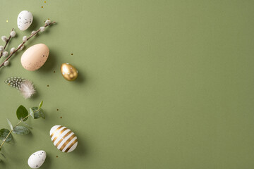 Wall Mural - Stylish arrangement of Easter eggs with natural decorations and greenery on a green surface