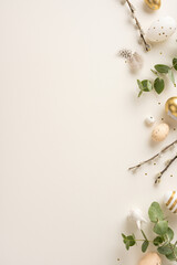 Wall Mural - Flat lay vertical image featuring Easter decorations with golden and white eggs, willow branches, and greenery creating a balanced and festive composition on a neutral background