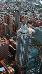 Wall Mural - Drone rising above the skyscraper complex in the Philadelphia downtown. Breathtaking view of the metropolis at daytime. Vertical video