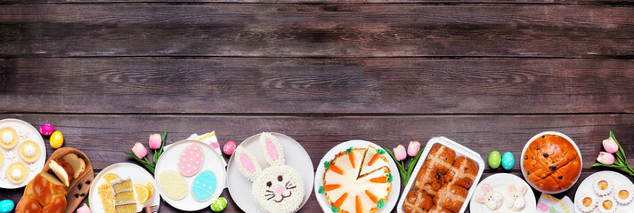 Aufkleber - easter or spring dessert food bottom border. top down view over a dark wood banner background. bunny