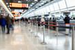 © Andres Mejia - Passengers waiting in line at airport check-in counter