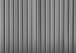© Maxim Chuev - Corrugated gray shiny metal sheet. New and Modern silver grey background pattern. metal aluminum silver corrugated stripe sheet wall backdrop with texture horizontal lines. White or grey iron sheet
