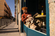 © Daniel - Sunny scene of Young ginger haired boy and his dog on the terrace of a cafe having a healthy breakfast