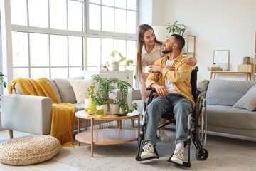 Poster - Young man in wheelchair and with wife at home