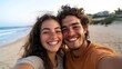© Z A C - Couple sharing a selfie on beach.