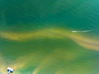 Wall Mural - Summer seascape beautiful waves,Tropical sea water in sunny day, Top view from drone camera,Amazing ocean colorful nature background, Beautiful bright sea waves splashing on beach sand