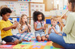 © peopleimages.com - Teacher, flute and students in classroom, education and musical instruments with talent. Group, educator and kids with skills, practice and training for performance, creativity and child development