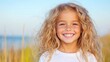 © Bella - Smiling girl with curly hair by the water. Possible use Stock photo for children's products