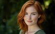 © Антон Федченко - Professional stock photo of a young woman with freckles and red hair, looking directly into the camera with a soft smile