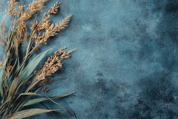 Wall Mural - Dried Plants Are Arranged Against A Dark Teal Painted Background