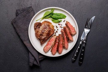 Poster - A perfectly cooked sliced striploin steak with a juicy, tender texture