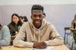 © unai - Smiling young man studying at university or high school