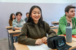 © unai - Smiling asian student attending a university lesson