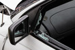 © Austockphoto - A broken car window and side mirror after a bad car crash accident in a white car