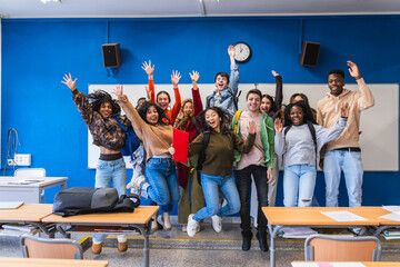 Canvas Print - High school students jumping together in classroom