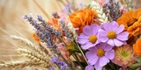 Summer arrangement with bright blooms, wheat, and dried lavender.