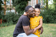 © Westend61 - Happy father hugging daughter in a park