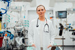 © Westend61 - Doctor in an emergency room with medical equipment in the background