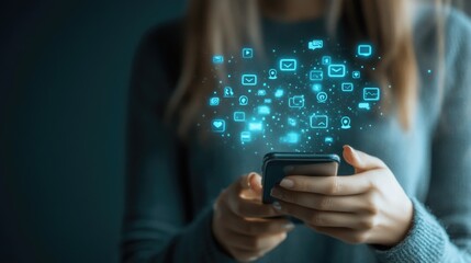 Digital communication technology showing a woman's hand gripping a smartphone, emitting social media symbols