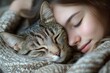 © ChaoticMind - Girl and cat share a cozy moment wrapped in a warm blanket on a peaceful day indoors