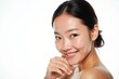 ©  S u n n y B u n n y - Portrait of a 20s Asian Female Model Smiling Softly with Natural Makeup and Glowing Skin Against a White Background