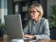 © Stock Image Paradise - Focused Businesswoman Working Late at Night on Computer in Office