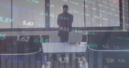 Wall Mural - image of diagrams and stock market over caucasian businessman thinking in office