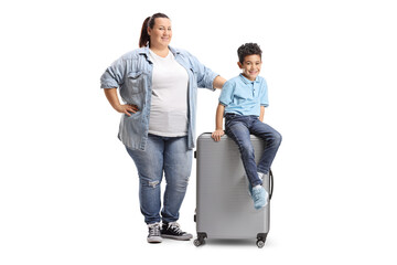 Canvas Print - Mother and son posing with a suitcase