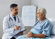 © Running opossum - Doctor showing medical chart and explaining diagnosis to senior man resting in hospital bed