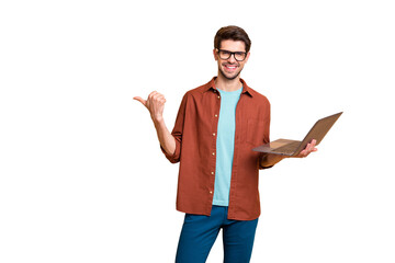 Fototapete - Portrait of his he nice attractive cheerful successful content brunet guy holding in hands laptop pointing thumb aside ad advert solution isolated over beige color pastel background