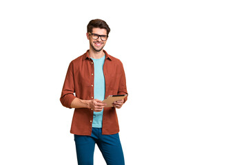 Portrait of his he nice attractive cheerful cheery successful content brunette guy holding in hands digital e-book browsing web app isolated over beige color pastel background