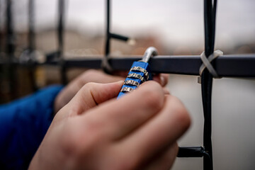 Close-Up Of A Man Holding A Code Lock