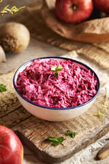 Wall Mural - A bowl of vegetable salad made of fresh beetroot, apples and sour cream