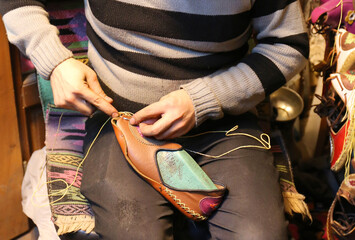 Unidentified Person stitching a Custom Order Hand Made Leather Shoe at Maras Souk in Kahramanmaras, Turkey