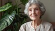 © atipong - Silver-haired Grandma Smiling With Indoor Plants