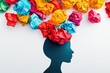 © photopixelstudio - Colorful crumpled paper ideas bursting from a head silhouette