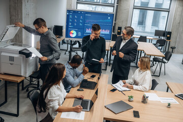 Wall Mural - Professional company. Group of office workers are indoors together