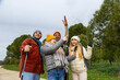 © luisrojasstock - Hikers using smartphone and pointing while enjoying trekking day