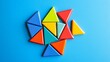 © Rauf - Magnet tiles on a Bright Blue Background. Geometric Triangles.