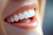 © Fotograf - A close-up shot of a person's mouth with white teeth, ideal for use in beauty or dental advertisements