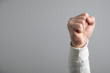 Wall Mural - Caucasian angry and aggressive man threatening with fist.