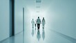 © Allie - Hospital rush in a hospital corridor. Featuring healthcare staff walking briskly