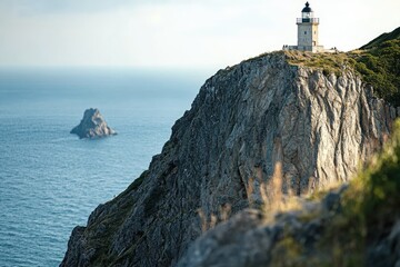 Wall Mural - a lighthouse stands tall on the edge of a cliff, overlooking the vast ocean below