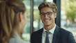 © AnCreaSpace - Smiling Young Businessman Meeting with Colleague in Modern Office Space