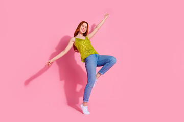 Wall Mural - Full body portrait of nice young lady dance empty space wear shiny top isolated on pink color background